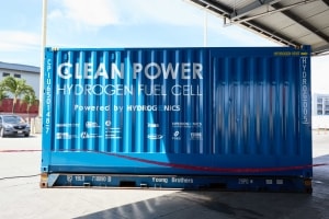 One side of the hydrogen generator advertises clean power and the companies that came together to create it.