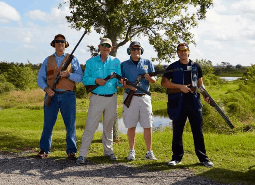 Tropical CEO Rick Murrell, second from left, poses with his friends at the range.