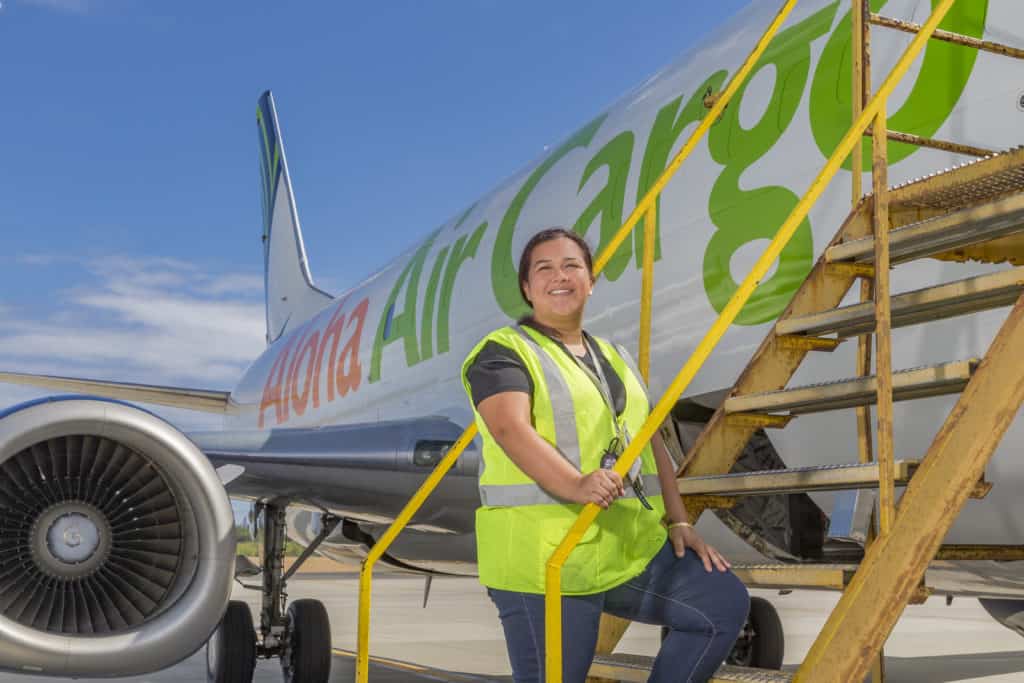 Medeiros steps up the stairs to an Aloha Air Cargo