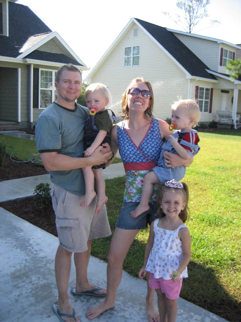 Dixon, his wife, and three kids pose outside their home in North Carolina.