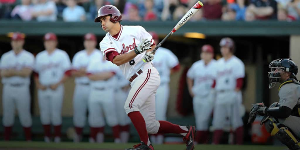 Johnny starts to run on his backswing at a Stanford ballgame.