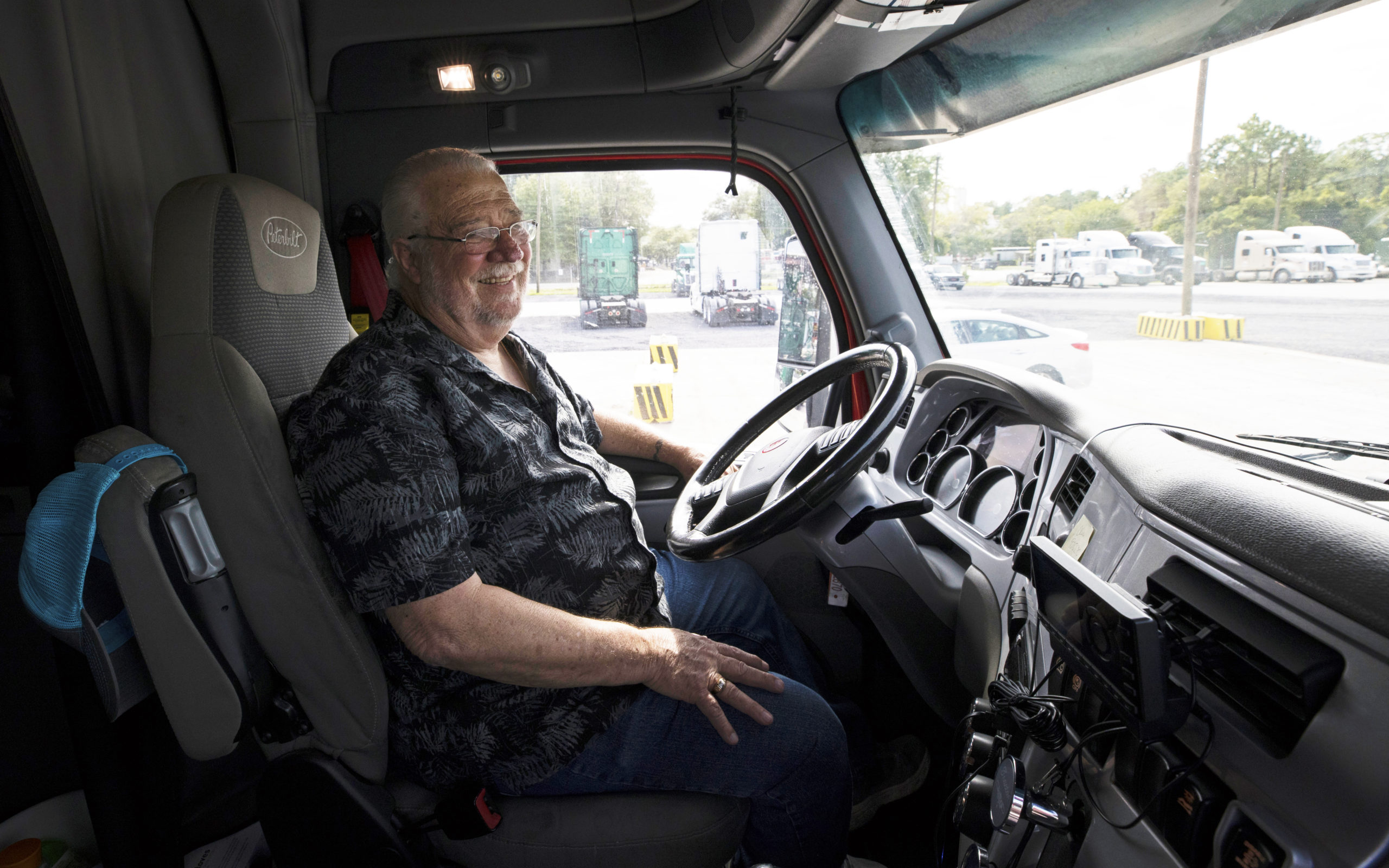 Allen smiles at the wheel of his truck.