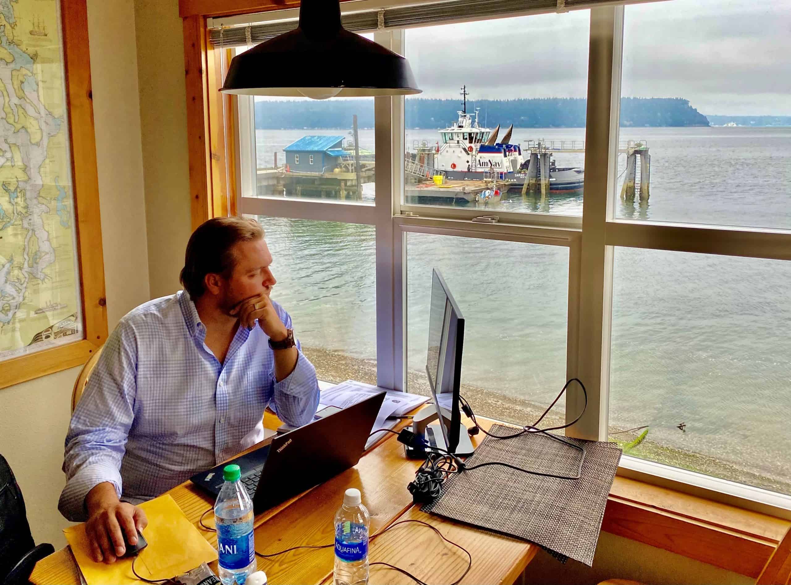 Westlund looks out his office window on a harbor.