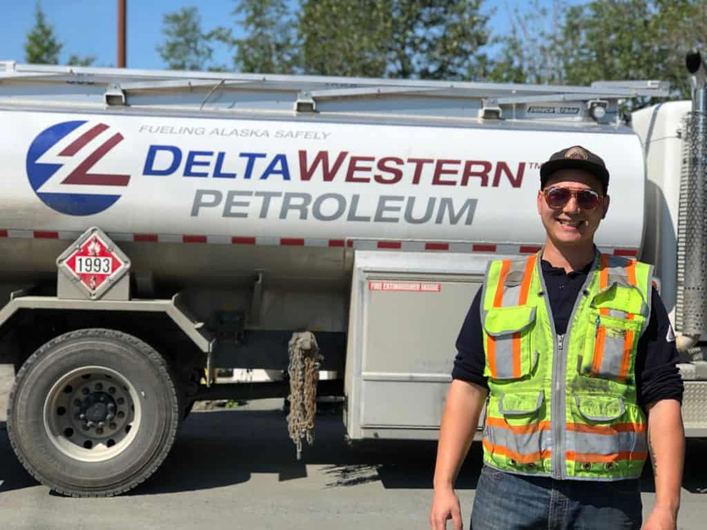 Walz poses in front of a Delta Western petroleum truck.