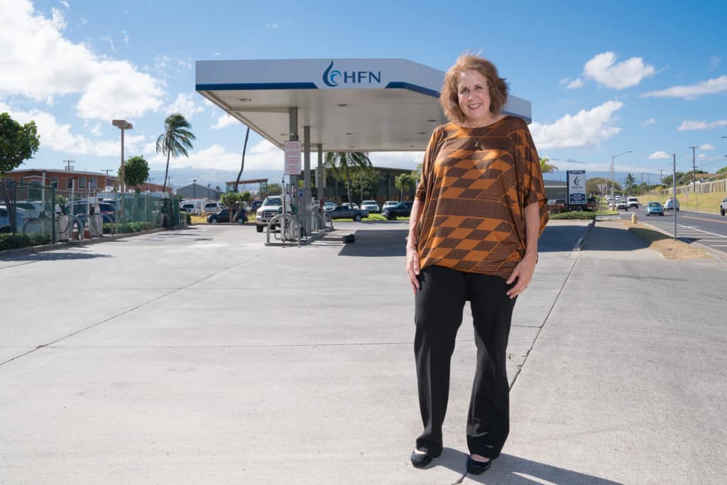 Montalvo stands in front of a Hawaii Fuel Network gas station.
